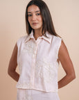 Peach sleeveless shirt embro