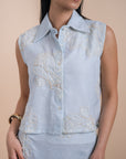 Blue sleeveless shirt embro