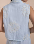 Blue sleeveless shirt embro